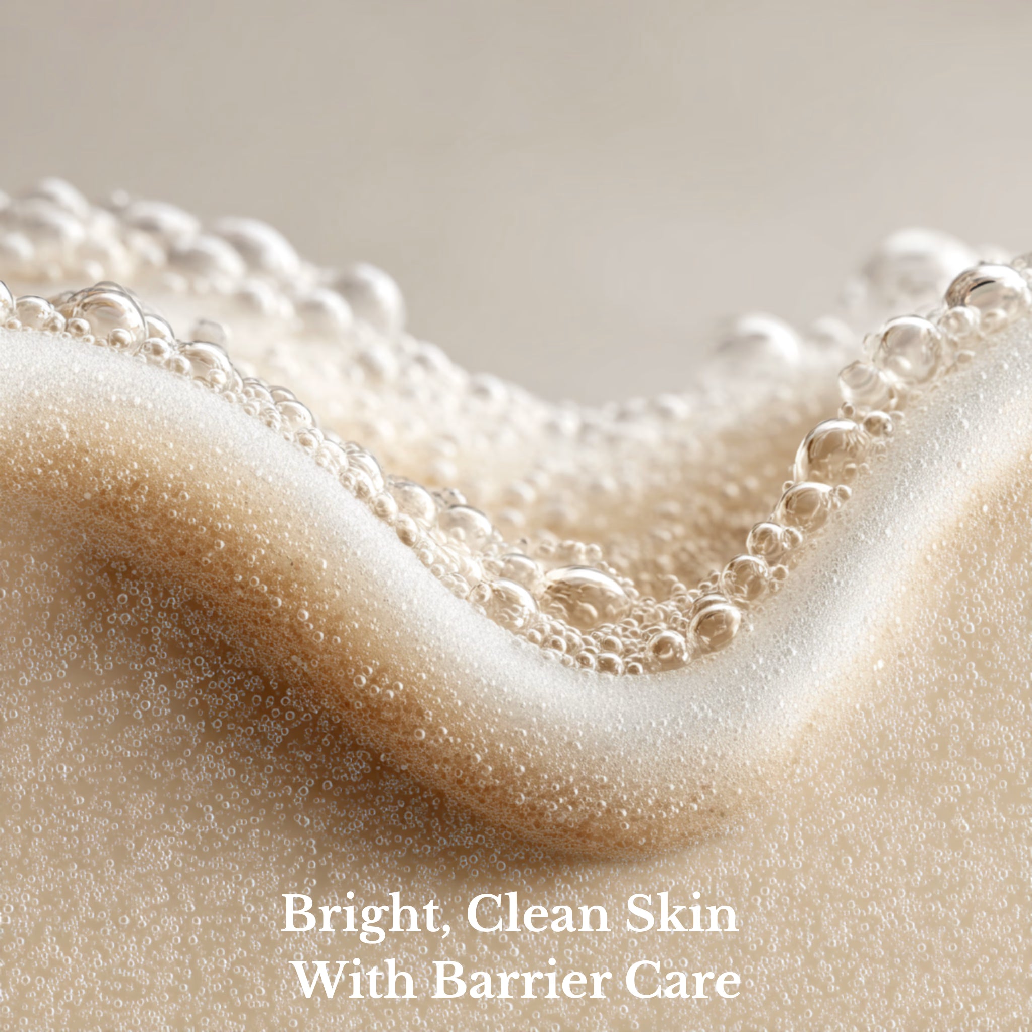 Close-up of a skincare product with bubbles and text 'Bright, Clean Skin With Barrier Care' on a neutral background.