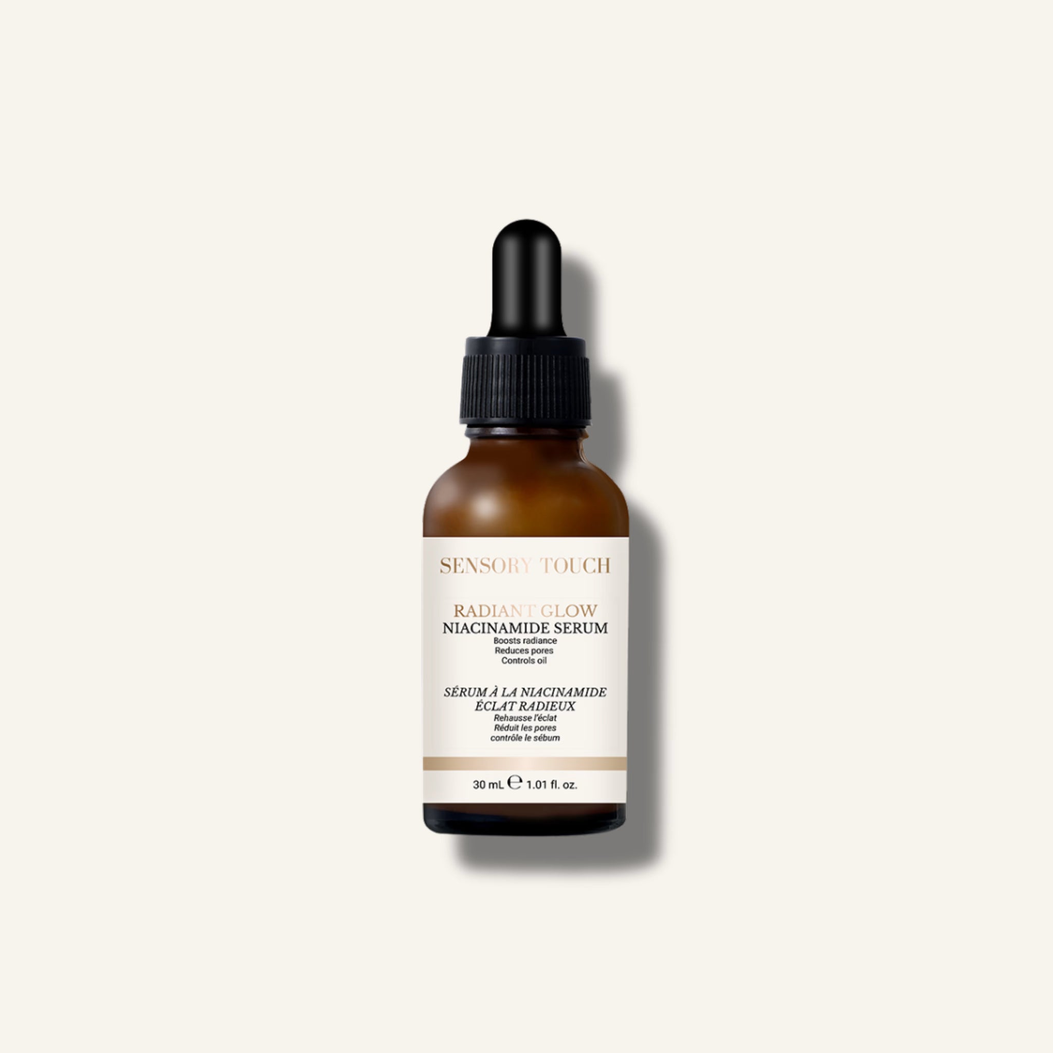 Skincare serum bottle with dropper on a light gray background