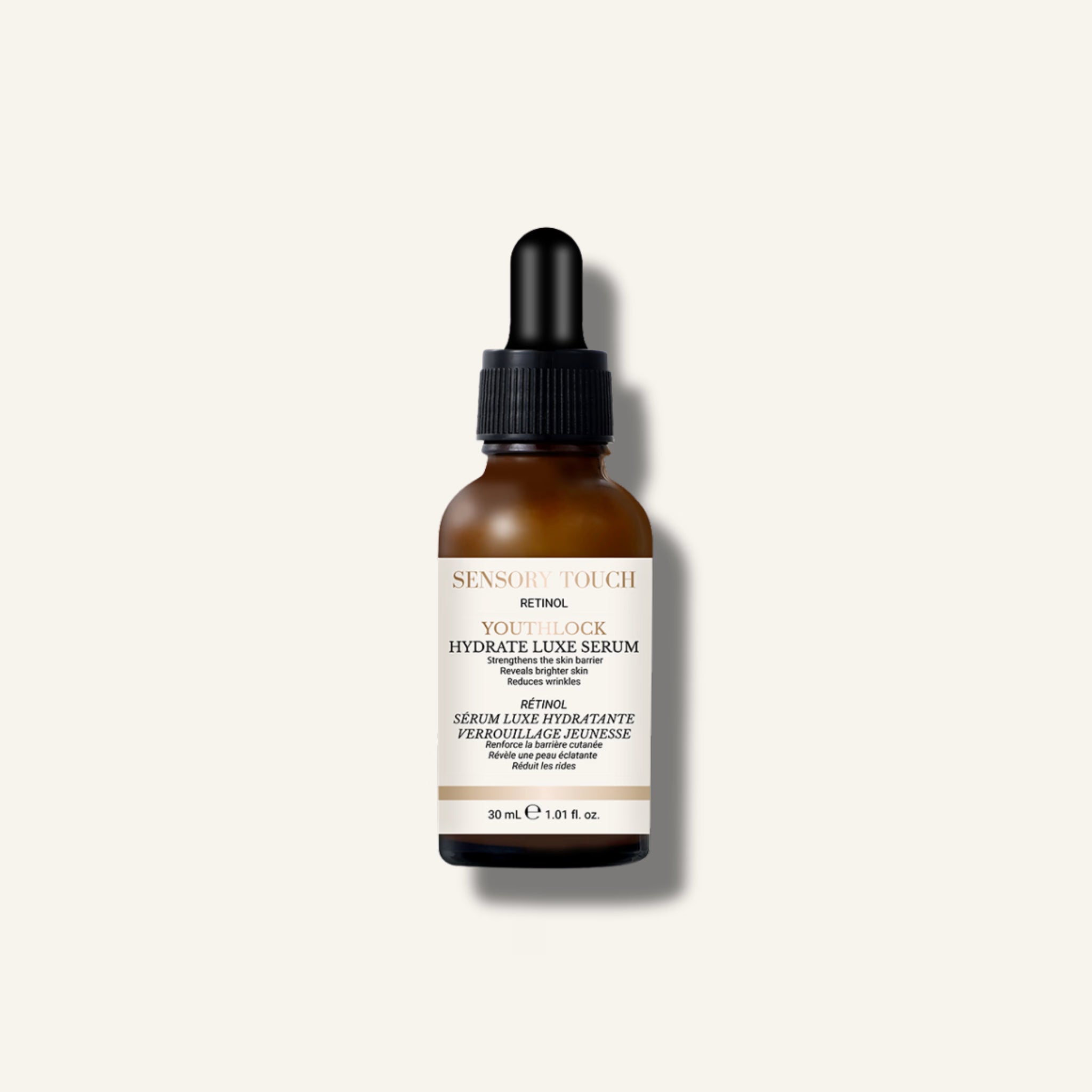 Skincare serum bottle with dropper on a light gray background